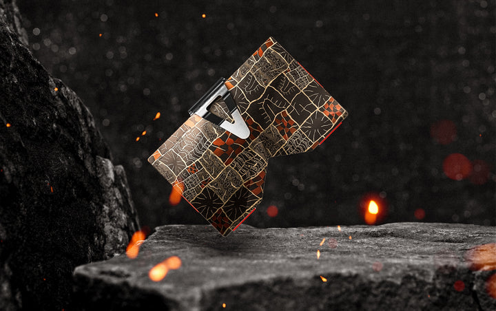 Mosaic Damascus wallet floating above a stone anvil surrounded by sparks