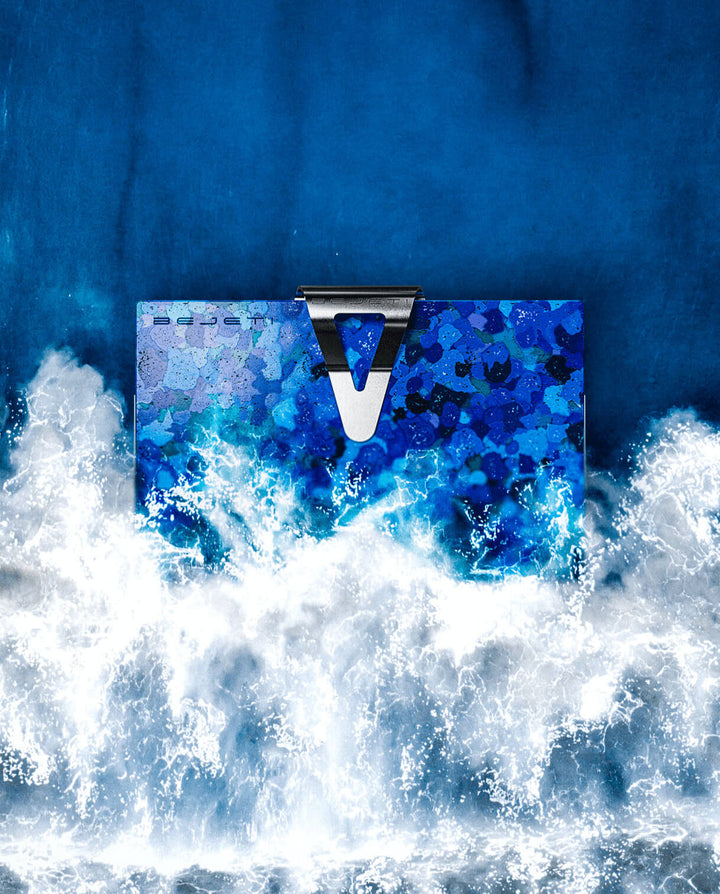 Ocean plastic wallet emerging out of the surf
